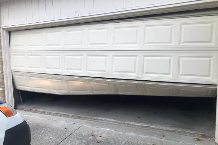 Off-track garage door repair service for misaligned and jammed doors