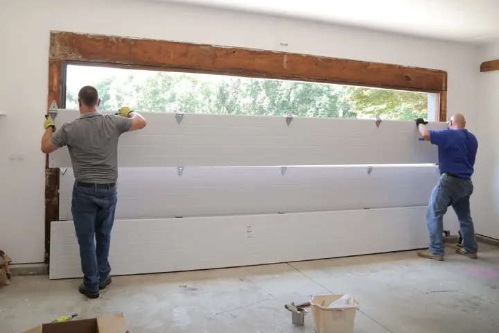 Garage door panel replacement for dented cracked and storm damaged sections